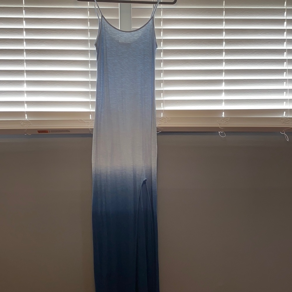 Long dress and has slit up to the thigh